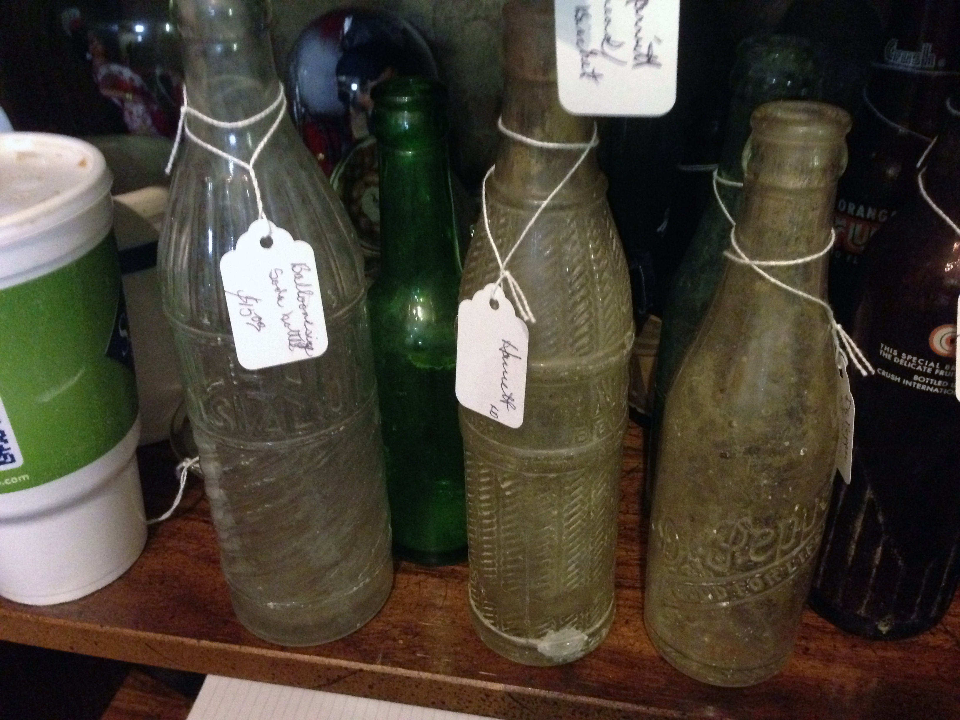 Shelf lineup including Balloon-embossed soda and related bottles (5 July 2014)