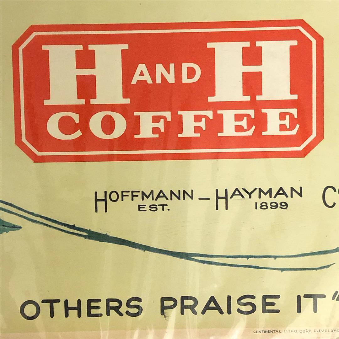 Detail of the H and H Coffee banner logo, Hoffmann-Hayman Est. 1899 line, and Continental Litho. Corp. Cleveland printer credit on the H and H Coffee cardboard litho sign.