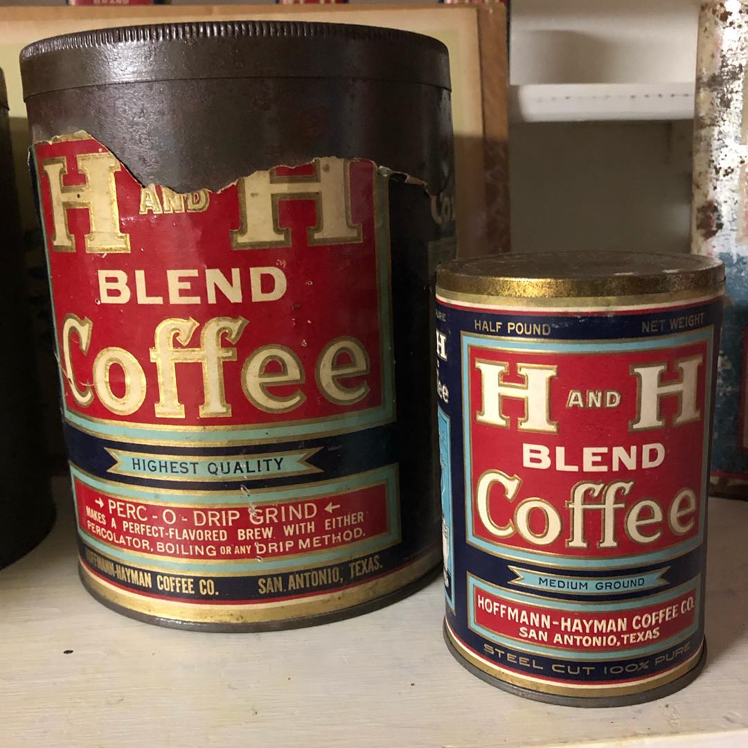 Scale comparison: the newly-arrived half-pound tin set beside the collection's larger three-pound Blend tin. The three-pound tin carries its own paper label with "H AND H BLEND Coffee / HIGHEST QUALITY / PERC-O-DRIP GRIND — MAKES A PERFECT-FLAVORED BREW WITH EITHER PERCOLATOR, BOILING OR ANY DRIP METHOD / HOFFMANN-HAYMAN COFFEE CO. SAN ANTONIO, TEXAS."