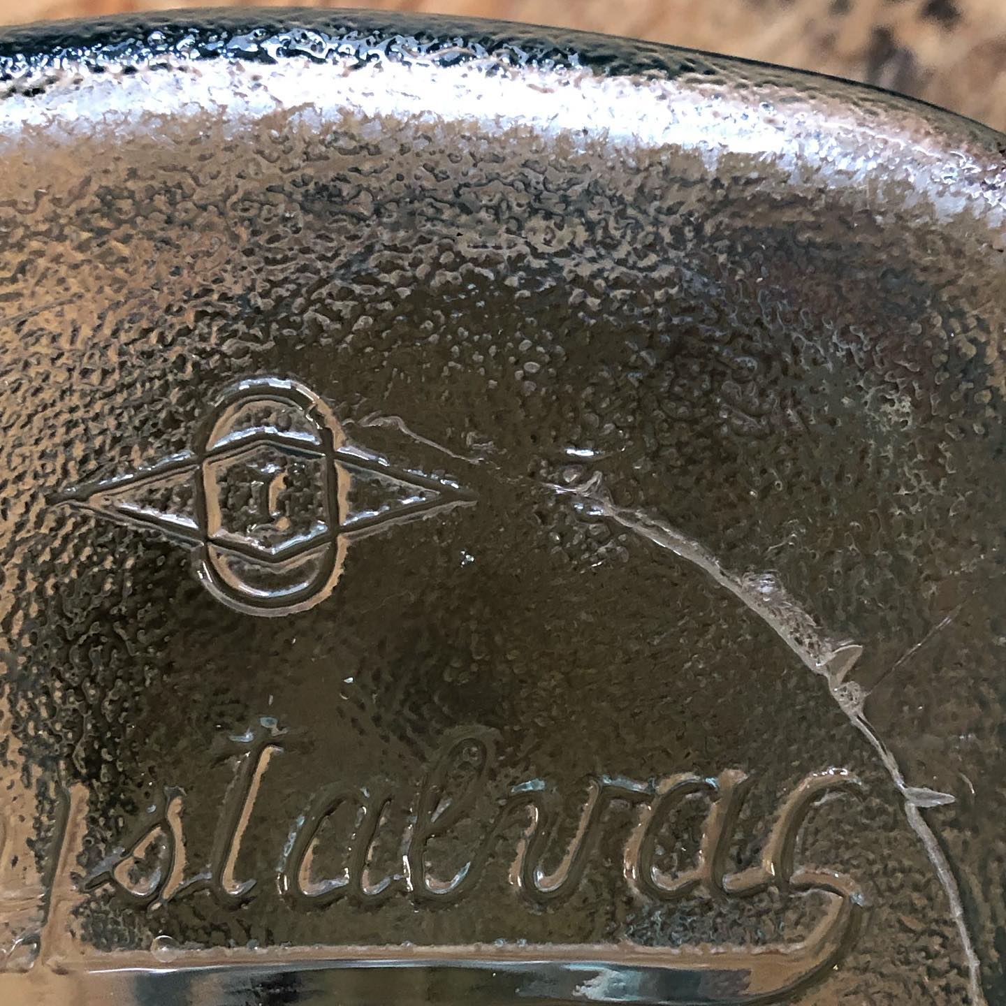 Embossed Owens-Illinois diamond-and-oval mark above the Crystalvac script on the jar's front panel