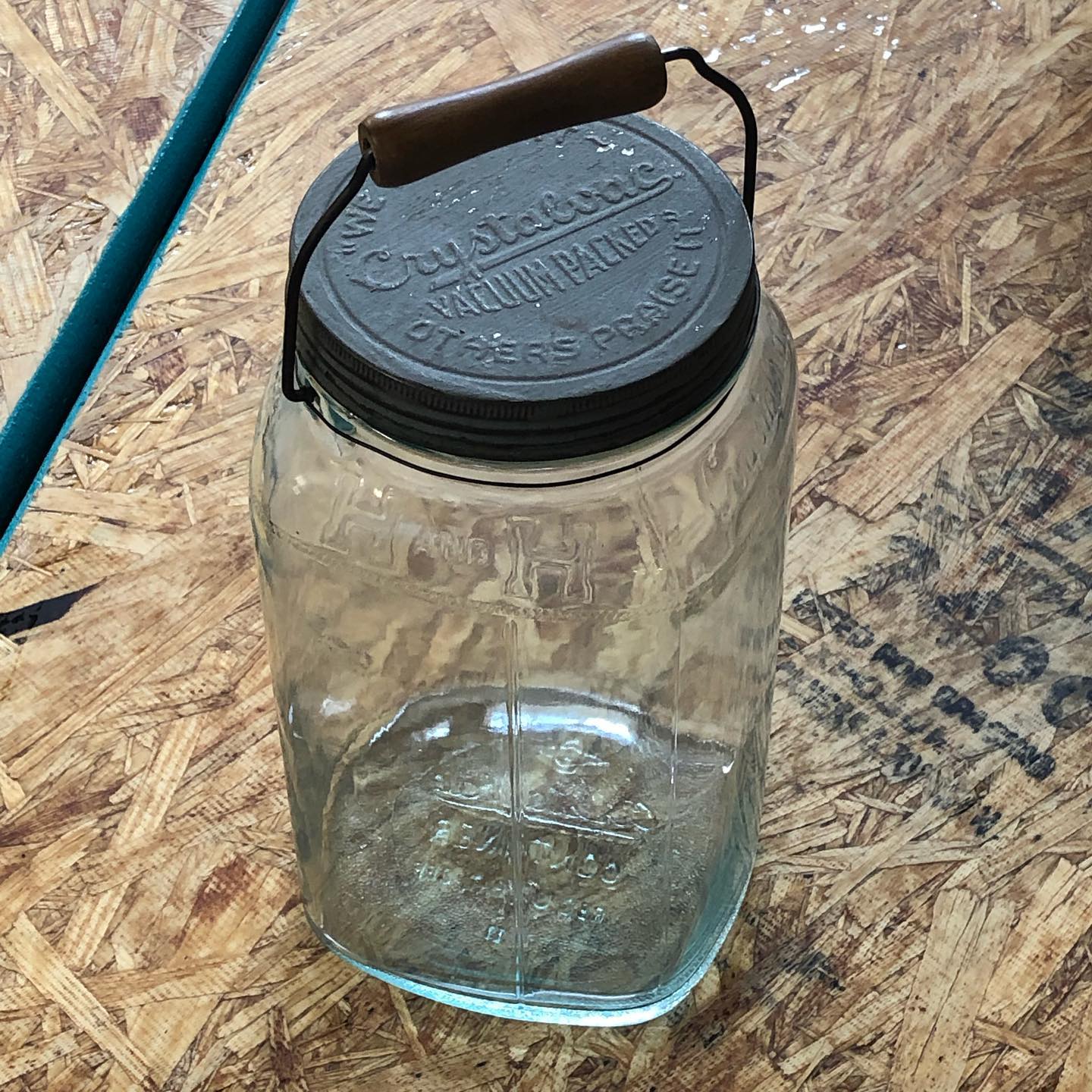 H and H aqua Crystalvac jar, full view with lid and bail