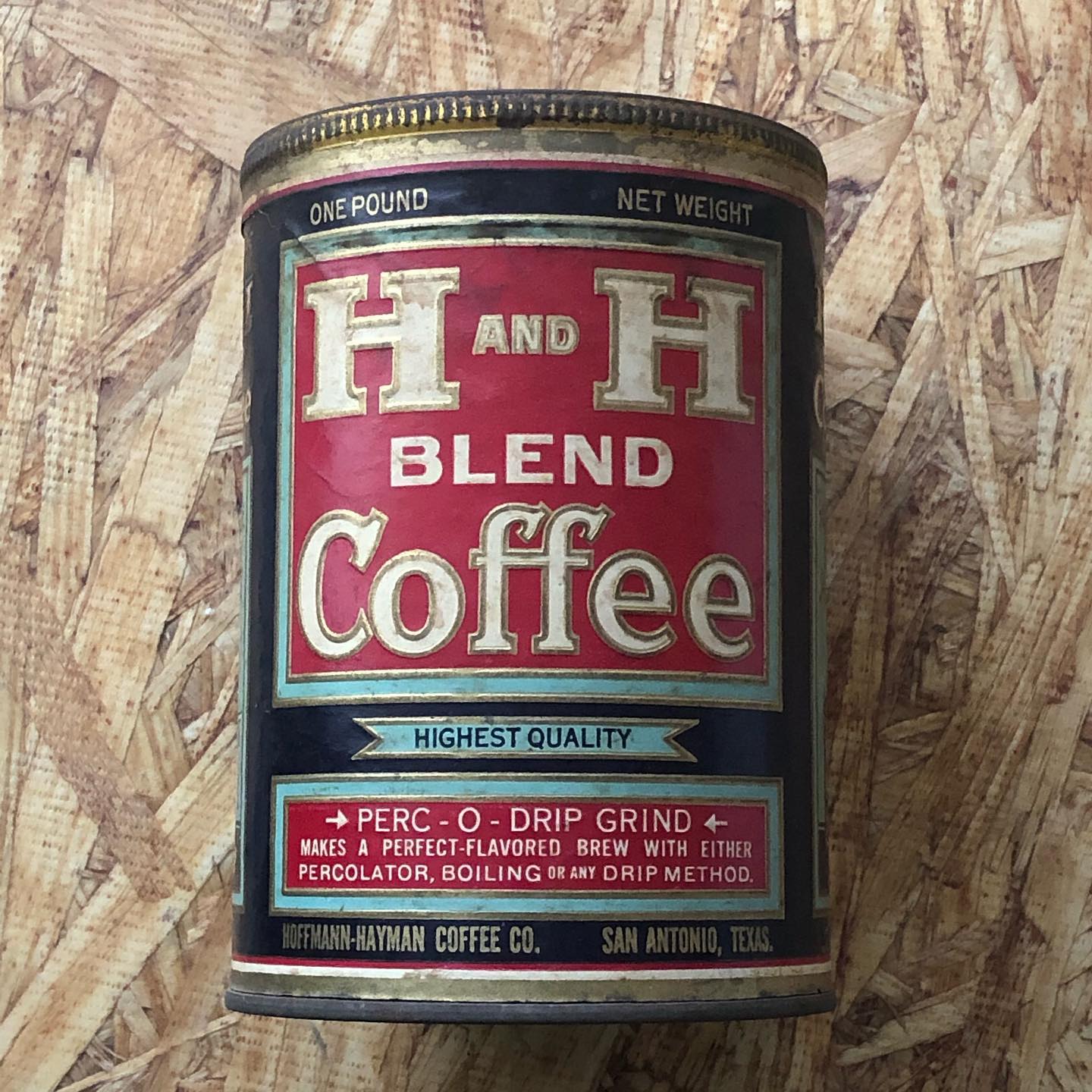 Unopened one pound tin with paper label.