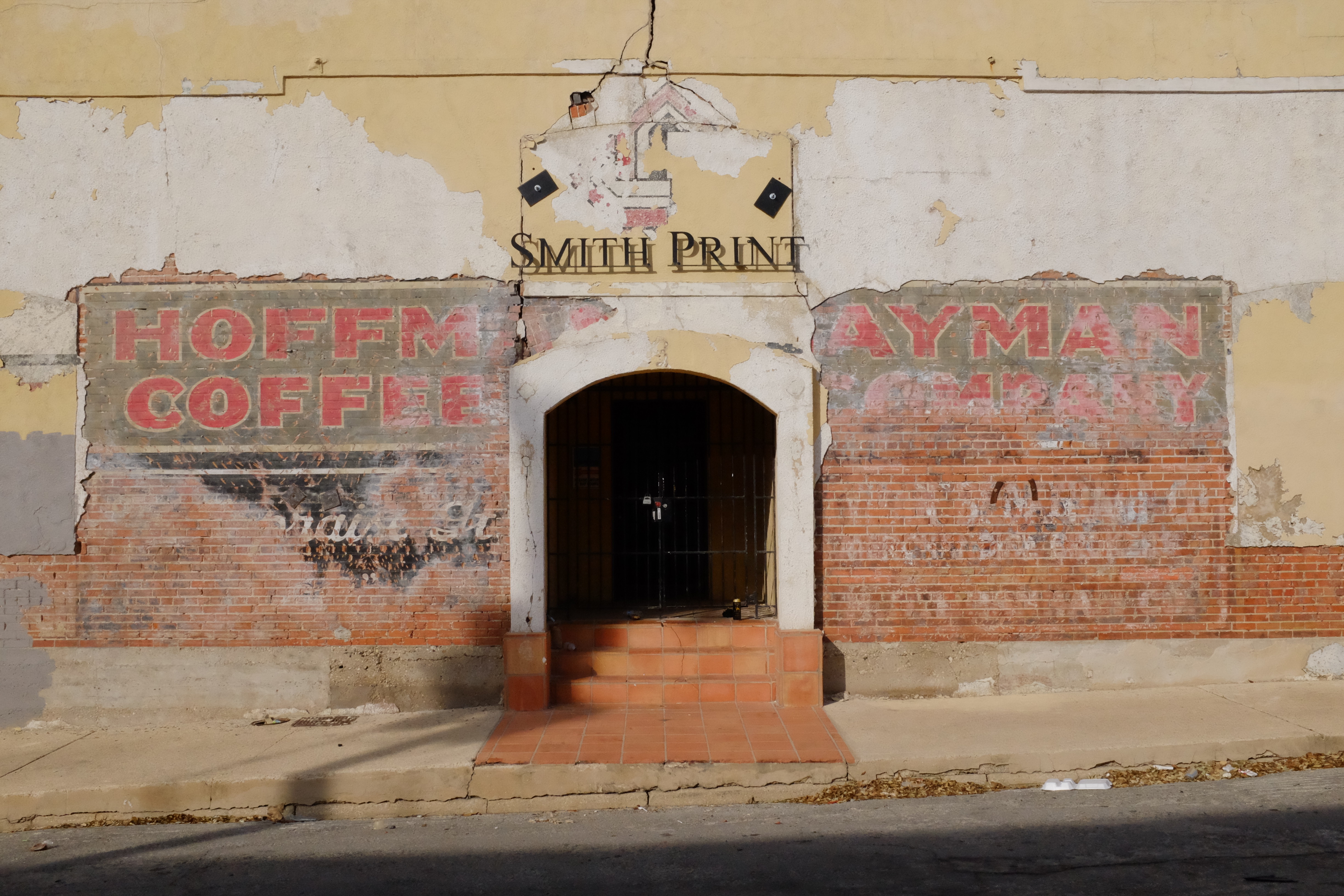 Elevated view — Smith Print arch; symmetric Hoffman Coffee / Hayman Company spreads