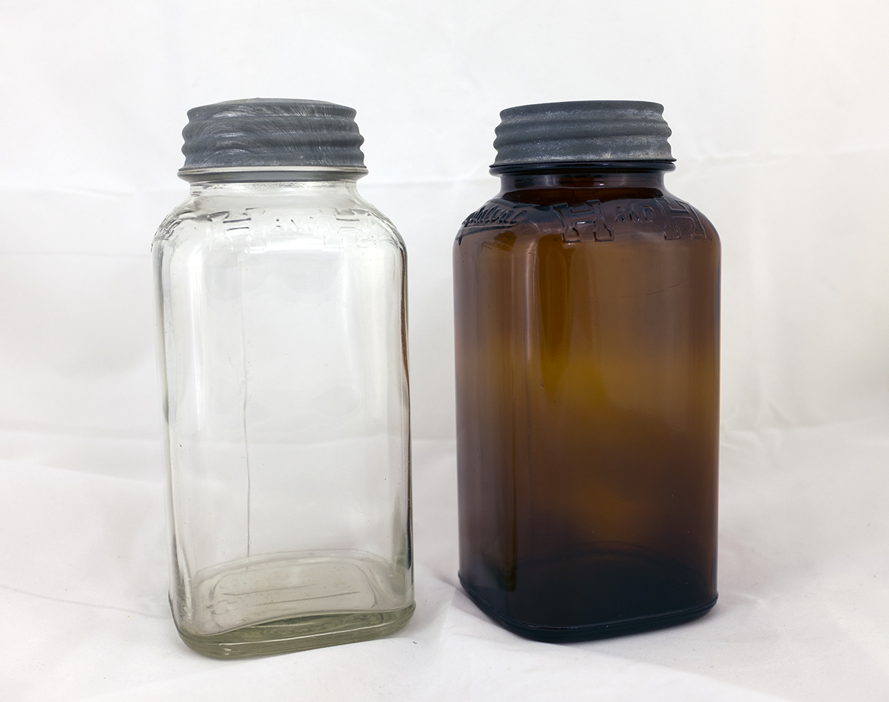 Small H and H Coffee Crystalvac jars from Three Rivers Glass Co.
