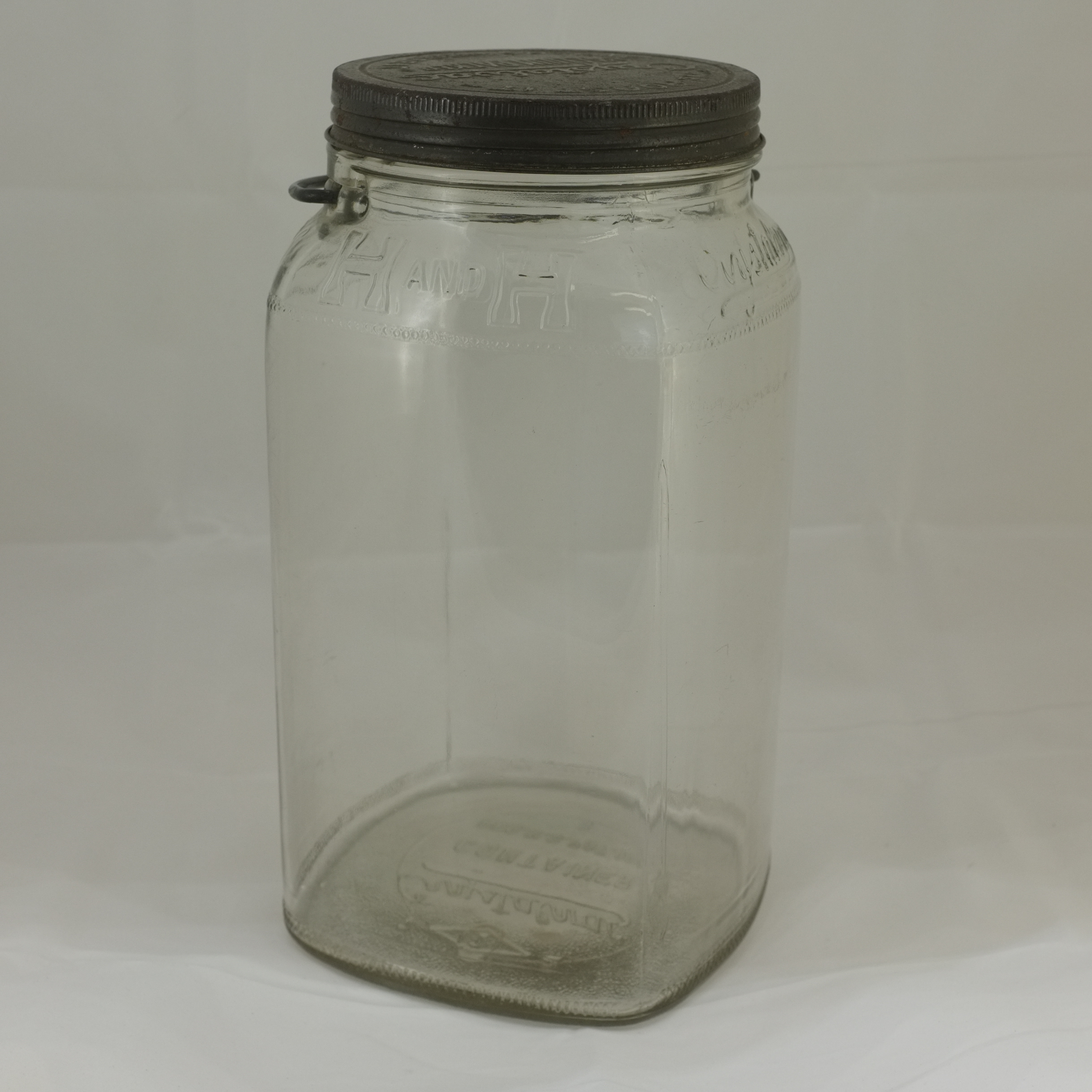 Clear large H and H Coffee Crystalvac jar, three-pound line, knurled cap and wire-bail stud