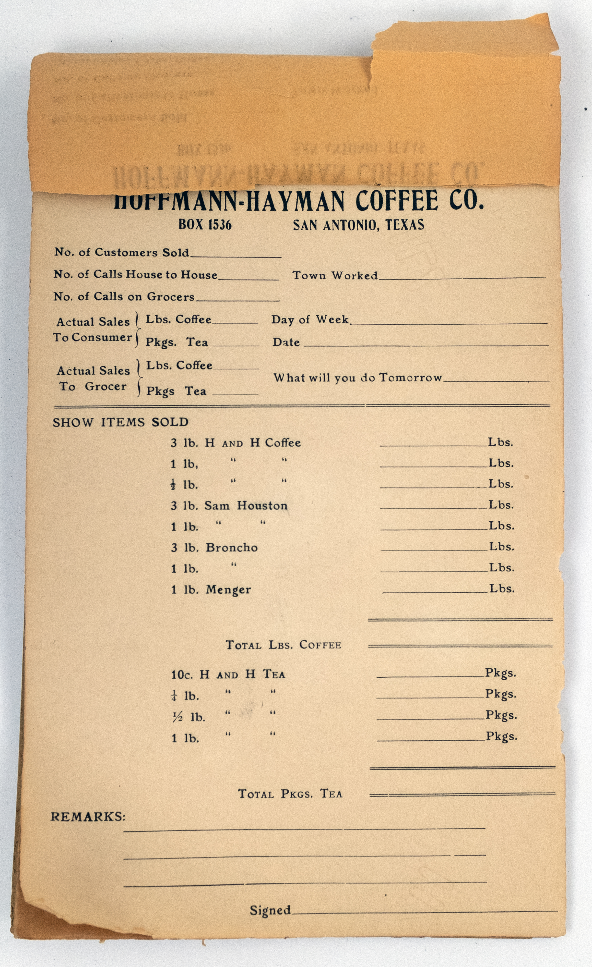 Open spread of sales report forms, product lines and handwritten entries, aged paper