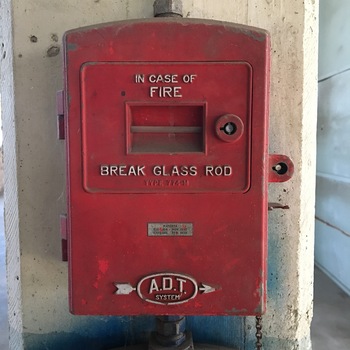 **17 November 2016** (**Apple iPhone 6s**) — red **A.D.T. System** manual station: **IN CASE OF FIRE / BREAK GLASS ROD**, **TYPE 774-M**, patent plaques **1937–1938**, conduit entries — vintage **central-station fire alarm** hardware on Hoffmann-Hayman plaster.
