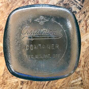 Base of the jar: "Crystalvac CONTAINER / REG. U.S. PAT. OFF / II" with the Owens-Illinois maker's mark