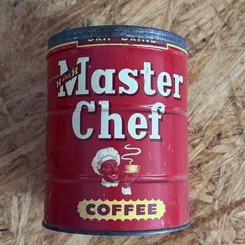 Master Chef two-pound keywind tin, white-script livery (earlier label generation than tin #1) — script 'Master Chef' lettering on red ground with chef-portrait roundel and yellow oval 'COFFEE' badge, H AND H diamond at lower left, photographed 2026-05-23 on the workshop OSB benchtop