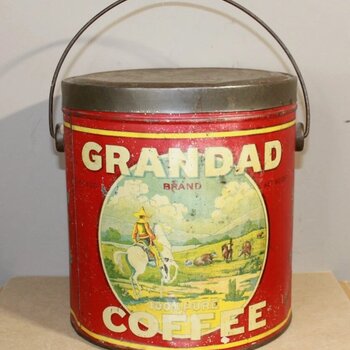 GRANDAD Brand 100% Pure Coffee pail tin — front view showing the red body, cowboy/ranch scene medallion, wire bail handle, and 'GRANDAD BRAND' / '100% PURE COFFEE' lettering