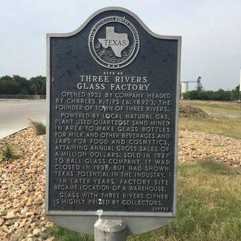 Field photograph of the **Texas Historical Commission** historical marker for the **Three Rivers Glass Company** (**circa 1920–1936**) at **Three Rivers, Texas** — the **South Texas glasshouse** whose **square vacuum jars** (**Crystalvac** packaging family) and other bottles **Hoffmann-Hayman** filled in San Antonio; **supplier-plant documentation** on **location**, **not** a photograph of the **Delaware Street coffee factory** itself — project reference frame (**Instagram 2017** outing; companion copy on **[Three Rivers Glass bottles]({{ site.baseurl }}/three_rivers_glass_bottles/)**)