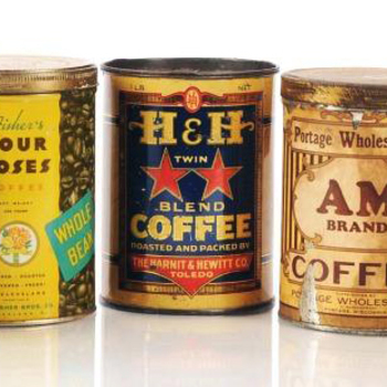 Three vintage coffee tins on white — **center**: **Harnit & Hewitt Co., Toledo** — dark label with large yellow **H&H**, red stars, **TWIN BLEND COFFEE**, banner *Roasted and Packed by the Harnit & Hewitt Co. Toledo* — unrelated **H&H** initial collision with Hoffmann-Hayman San Antonio; **left** Fisher's Four Roses Whole Bean; **right** AM Brand — shelf comparison context only.